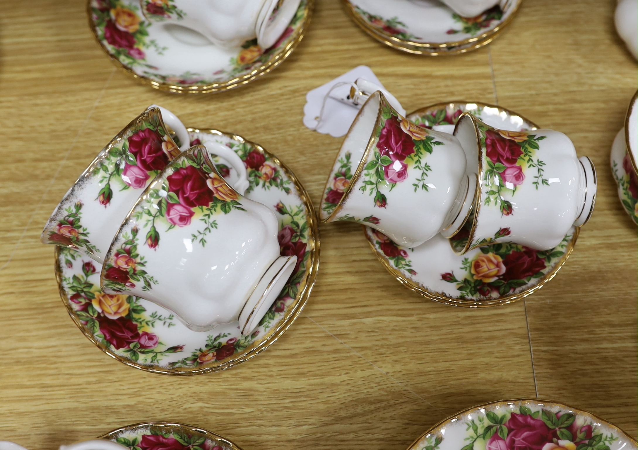 A Royal Albert Old Country Rose dinner service and tea service including trios, tureens and oval dishes